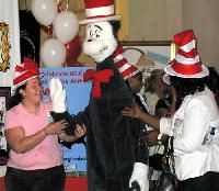 The Cat in the Hat is ushered onstage by members of his entourage.